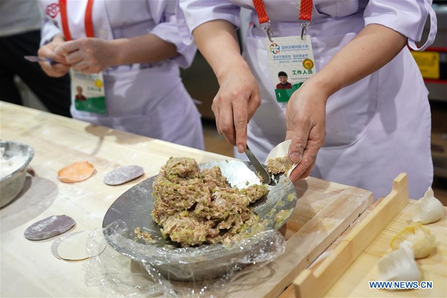 Cooks make delicious food during Asian Cuisine Festival in Beijing